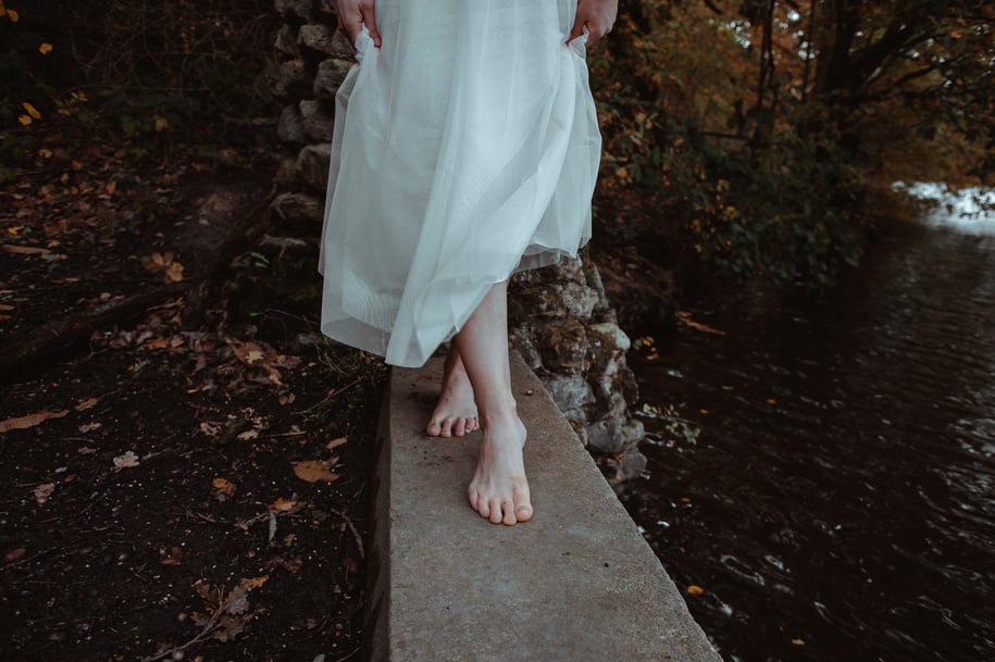 Woman in White Dress Standing on Gray Concrete Path